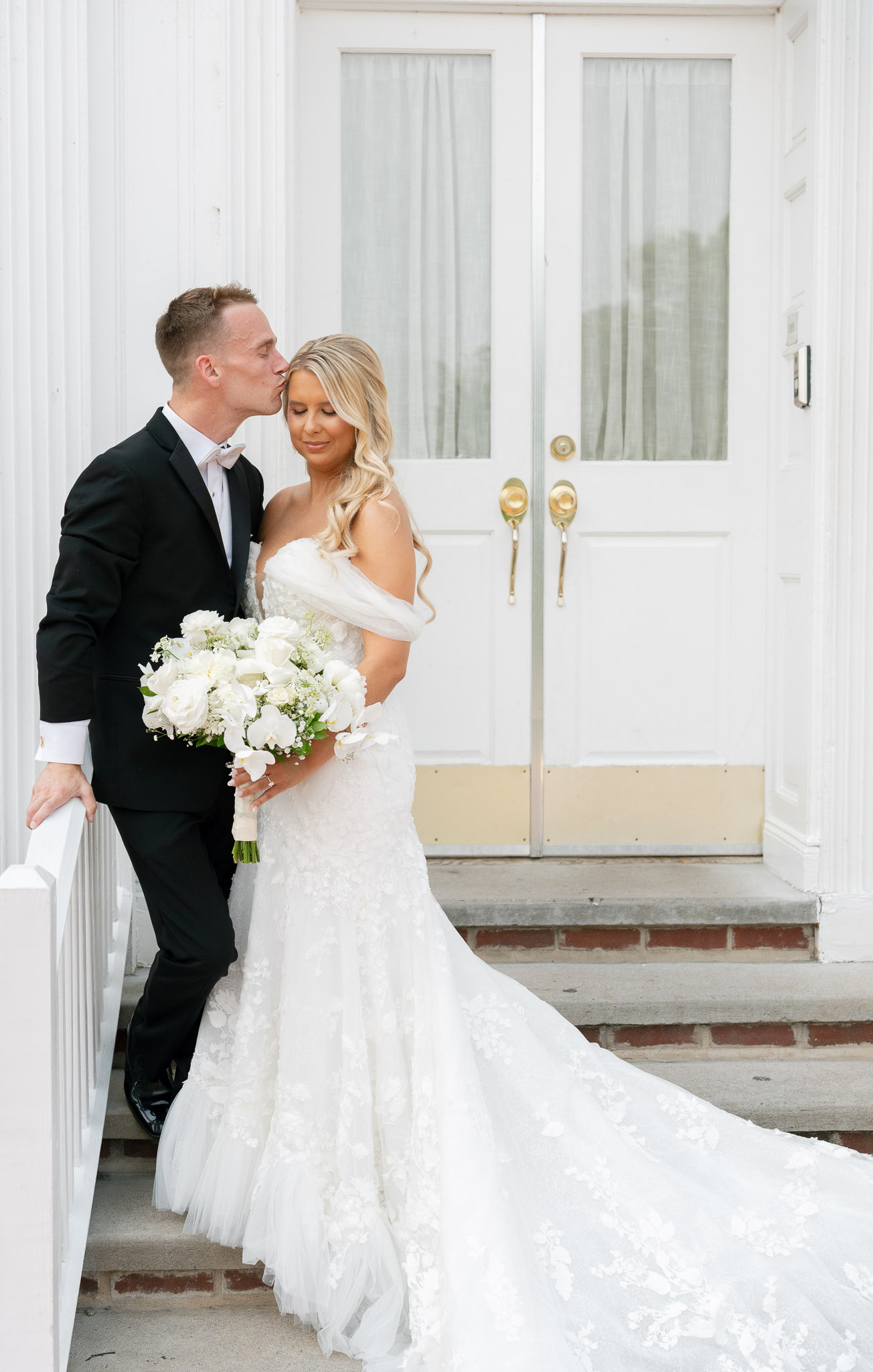 Couple standing at the door of Pen Ryn Estate for an editorial style bridal portrait